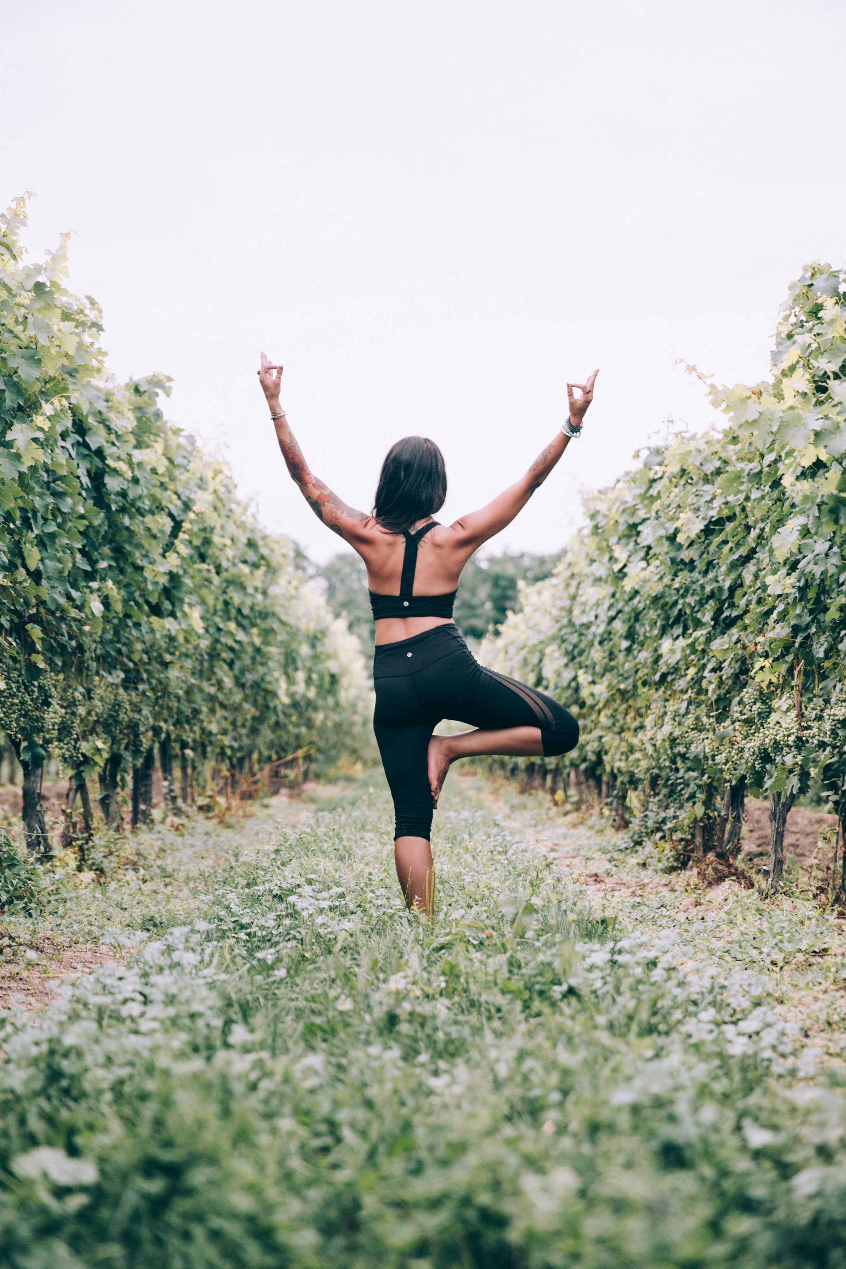 Woman doing Yoga in a feild